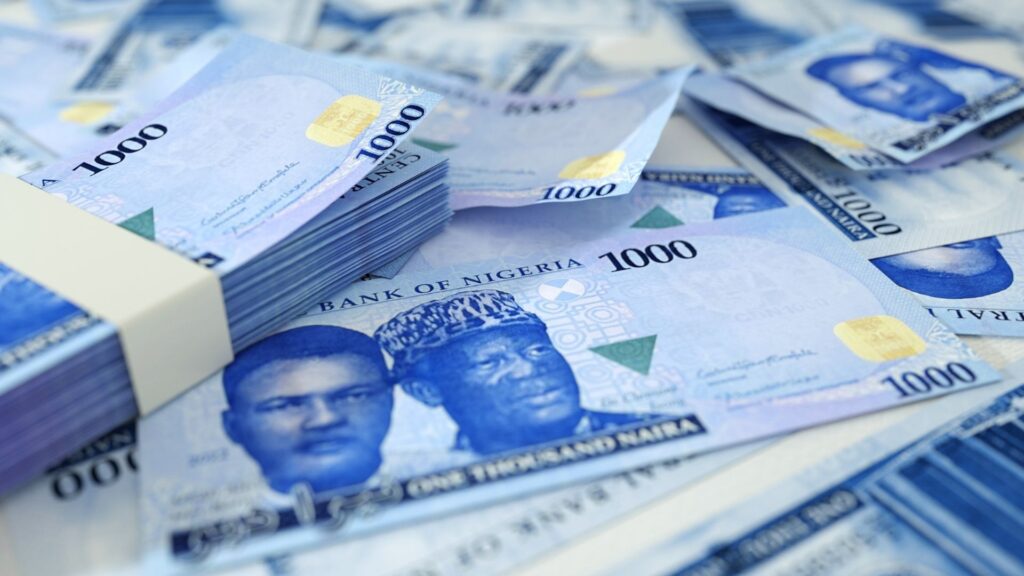 Nigerian naira banknotes stacked representing capital erosion during off-plan property construction Nigeria